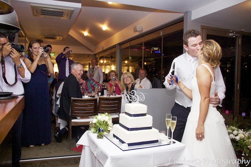 Couple cutting the wedding cake - wedding photography sydney